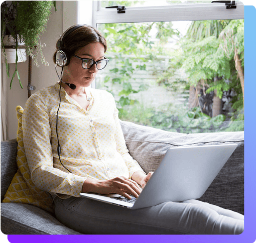 Girl working from home on a headset and laptop